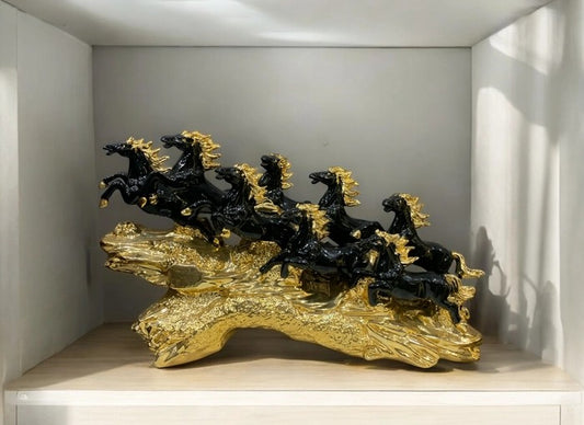 seven horses decorative showpiece in black and gold finish placed on a wooden shelf – 13x20 inch size.